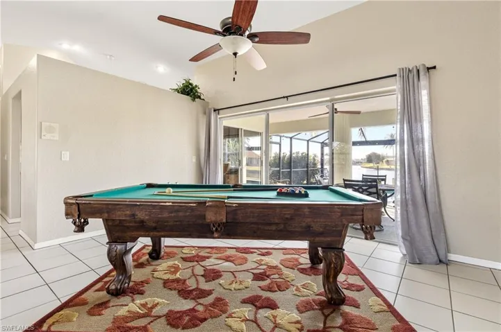 Recreation room featuring billiards, ceiling fan, light tile patterned floors, lofted ceiling, and recessed lighting