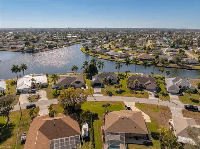 Aerial view of residential area with a nearby body of water