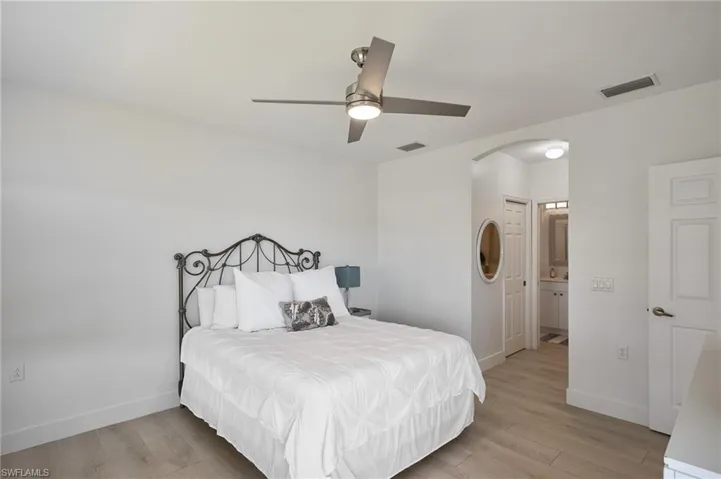 Bedroom featuring ceiling fan and light wood-type flooring