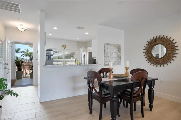 Dining area with light hardwood / wood-style floors