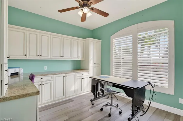 Home office/craft room, featuring a ceiling fan and Vinyl floors