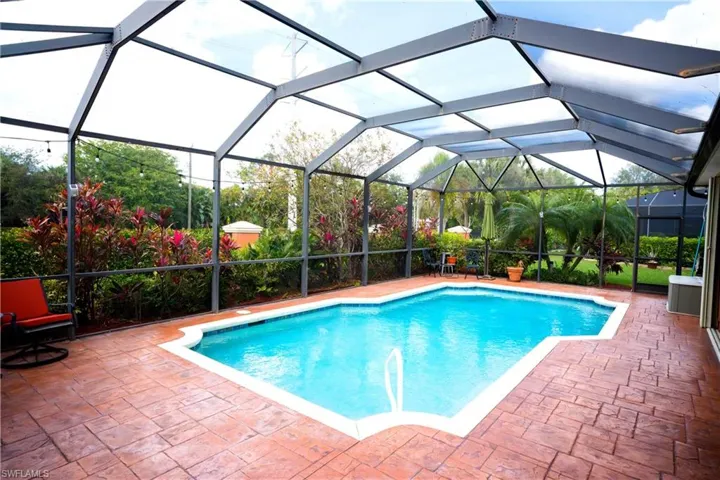 View of pool featuring a lanai and a patio area