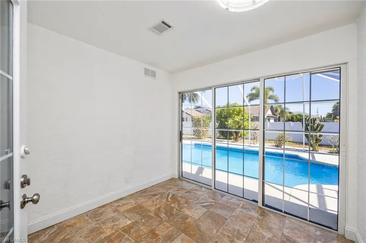 View of swimming pool from the ensuite sunroom