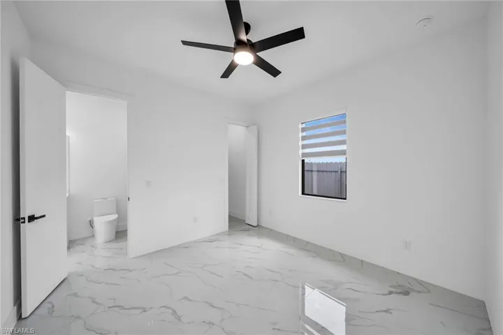 Unfurnished room featuring ceiling fan