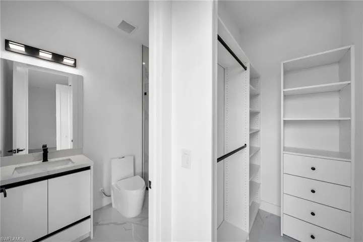Bathroom featuring vanity and toilet