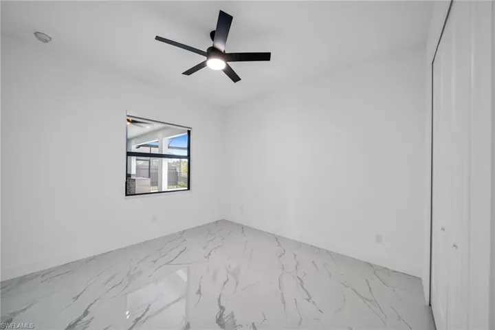 Spare room featuring ceiling fan