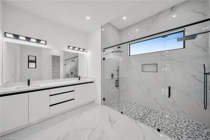 Bathroom with an enclosed shower and vanity