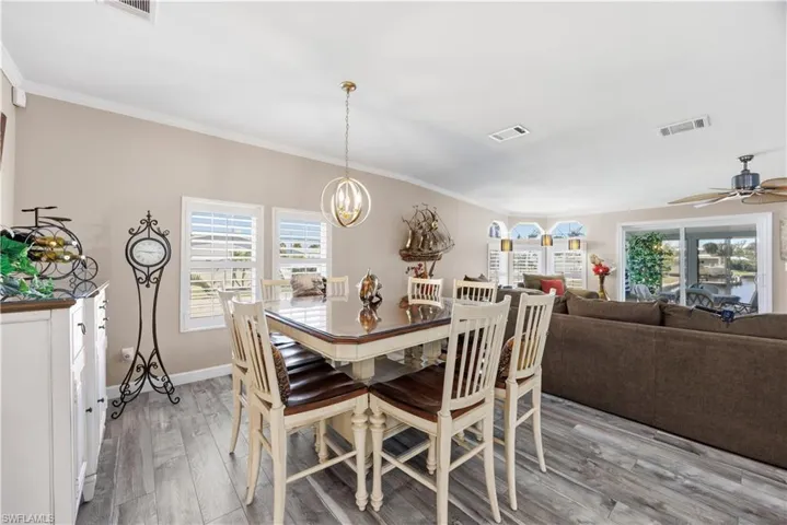 Dining area open to living space with water views