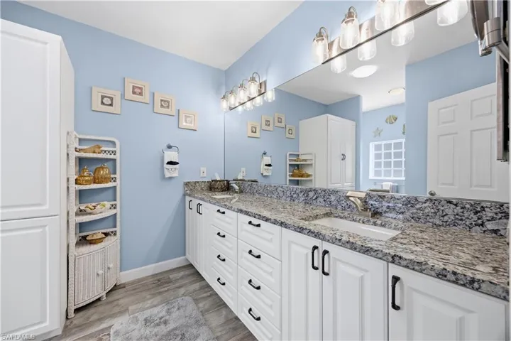 Primary bath with granite counters and ample storage