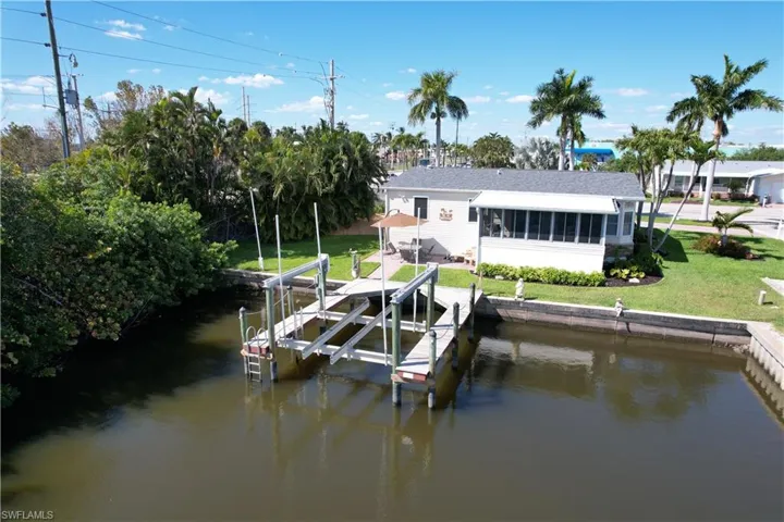 Aerial view of home with private dock and boat lift