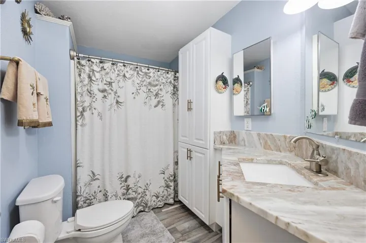 Guest bathroom with updated vanity and shower tub combo