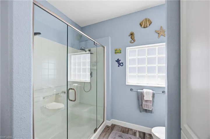 Primary bath with walk in shower and glass enclosure
