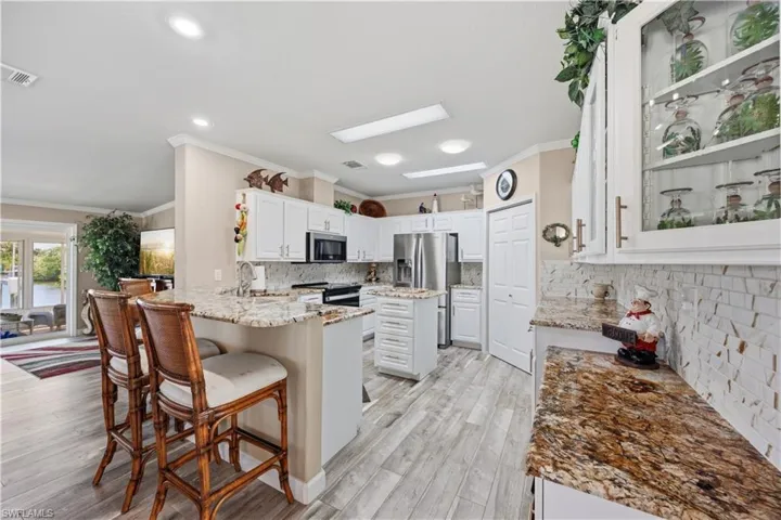Updated kitchen with granite counters and breakfast bar