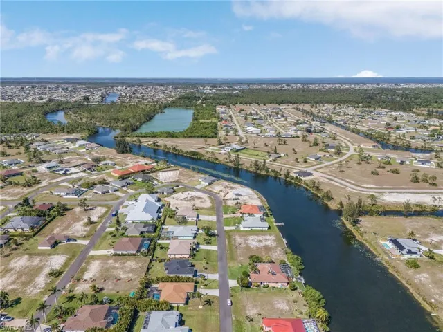 Birds eye view of property featuring a residential view and a water view