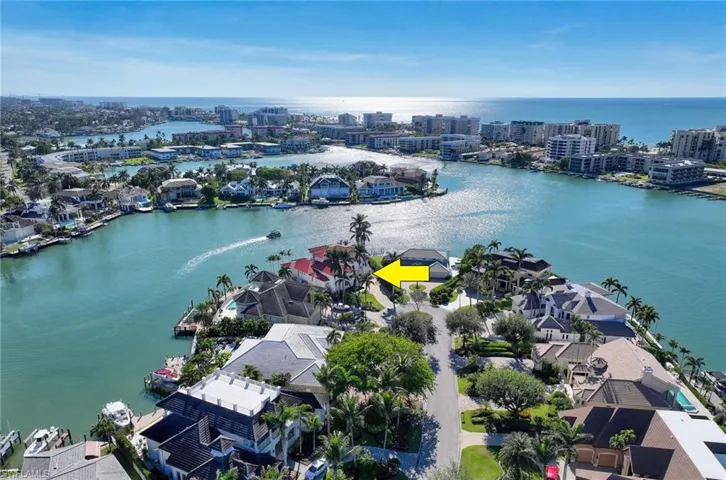 Birds eye view of property with a water view