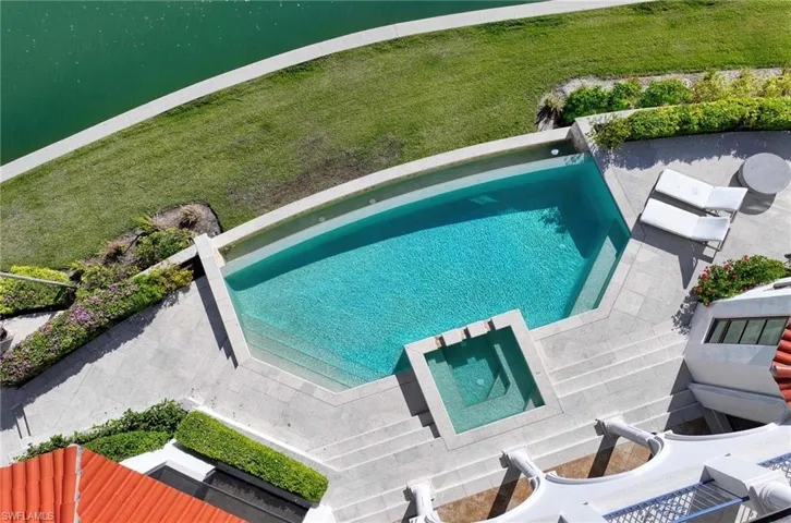 View of pool with a water view