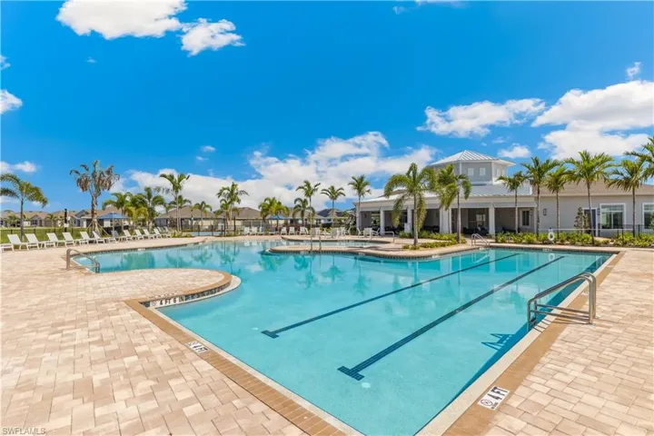 Community pool with a patio