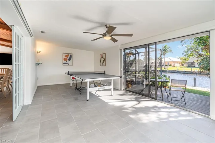Playroom featuring tile flooring and a water view