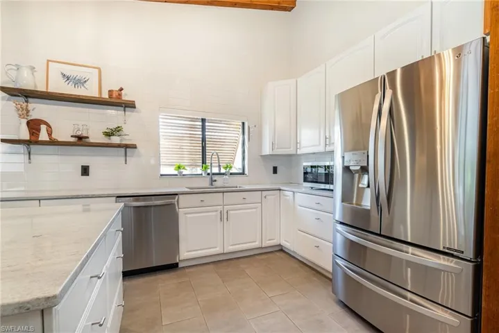 Kitchen featuring a large kitchen sink stainless steel appliances