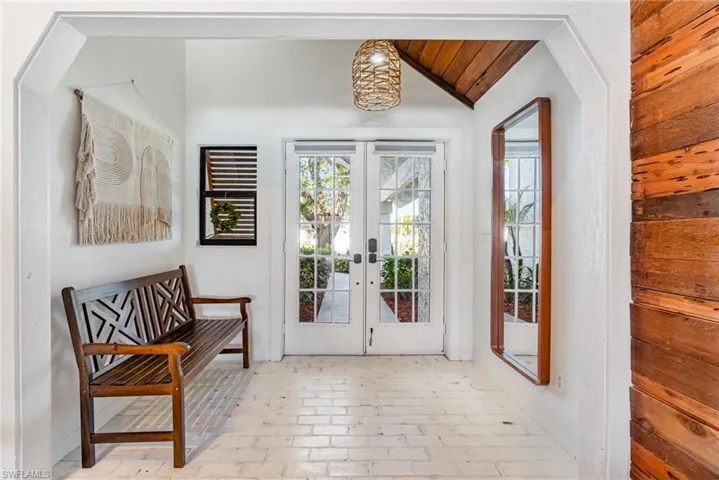 Doorway with brick floor and french doors