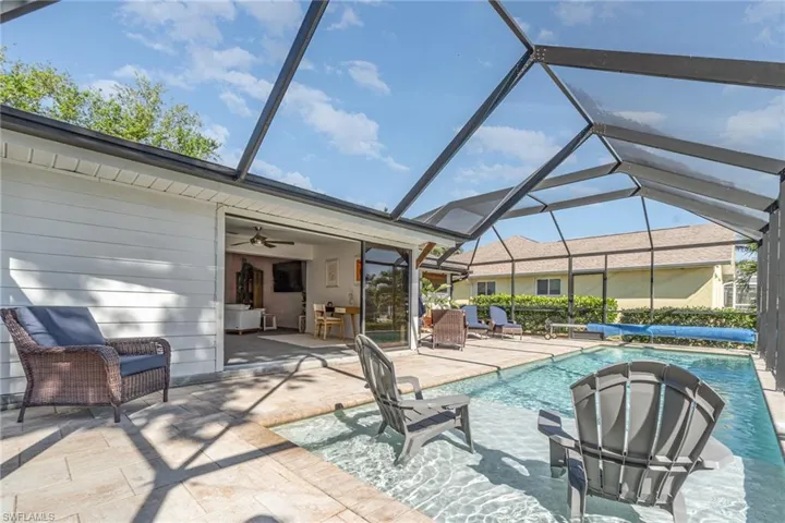 Outdoor pool featuring a sun shelf