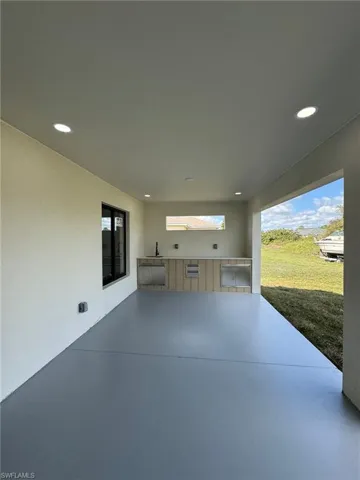 View of patio / terrace with an outdoor kitchen and sink