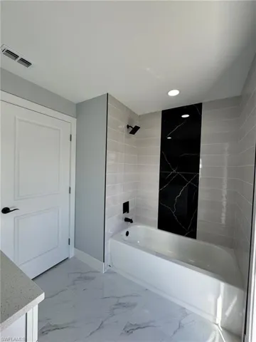 Bathroom featuring tiled shower / bath