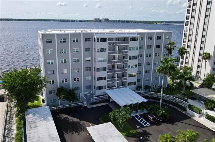 View of property with a water view