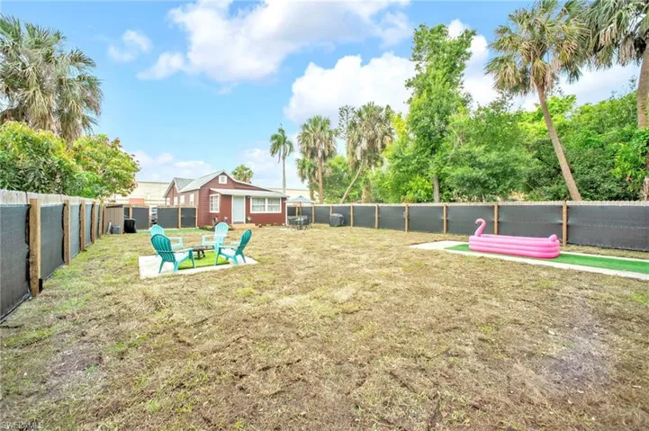 View of yard with a fire pit