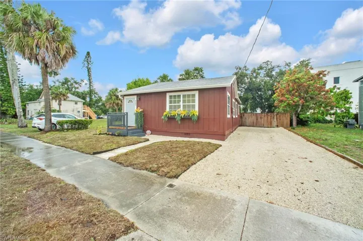 Bungalow-style house featuring gravel driveway and crawl space