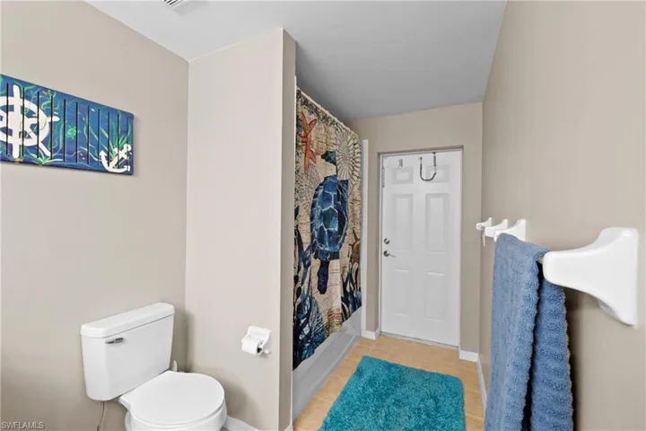 Bathroom with tile floors and toilet
