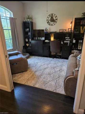 Bedroom featuring dark hardwood / wood-style floors