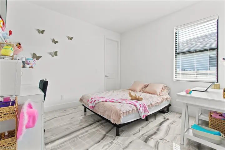 Bedroom featuring baseboards