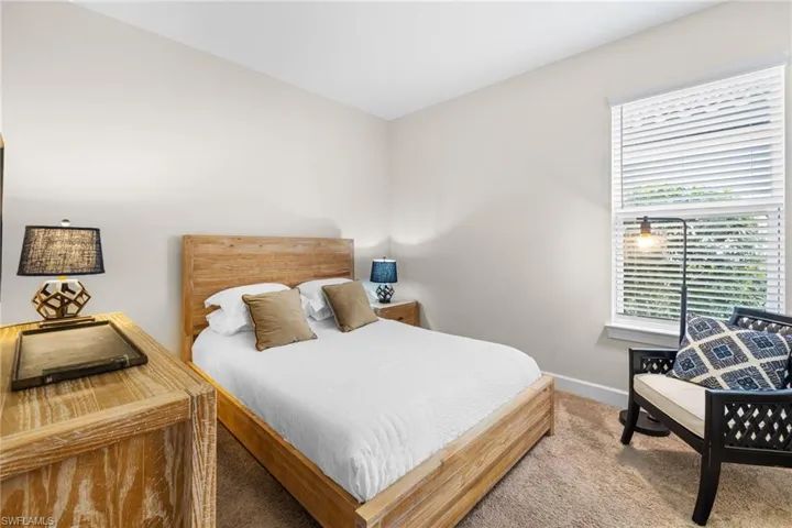 Carpeted bedroom with baseboards