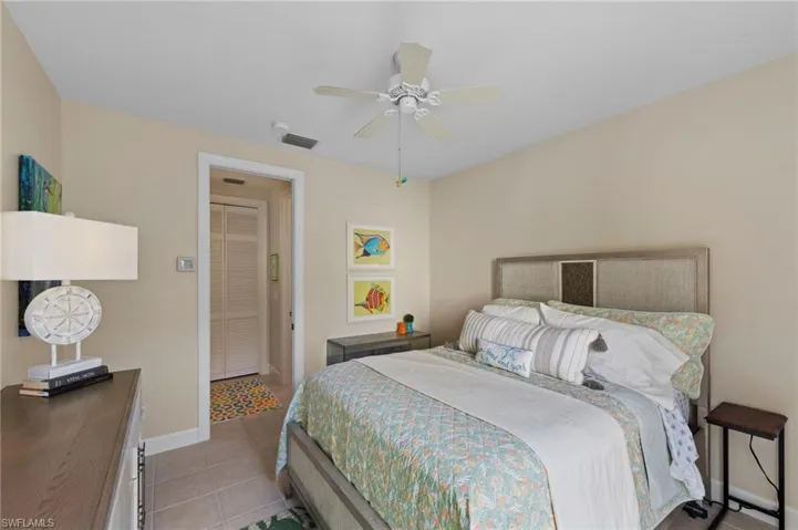 Bedroom featuring light tile patterned flooring and a ceiling fan