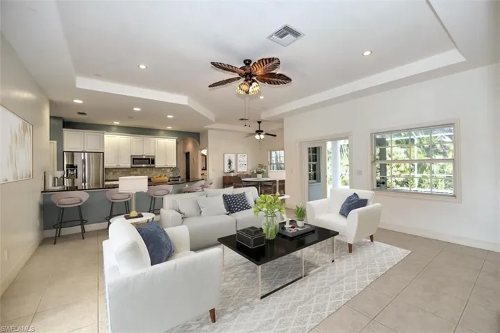 Tray Ceilings in Spacious Family Room with French Doors to Pool Area