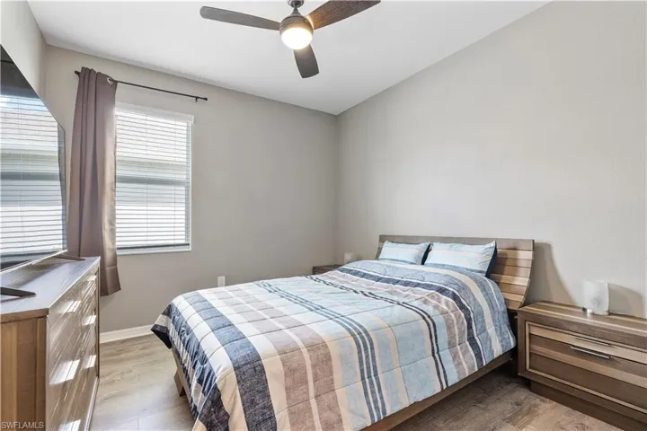 Bedroom with light wood-type flooring and ceiling fan