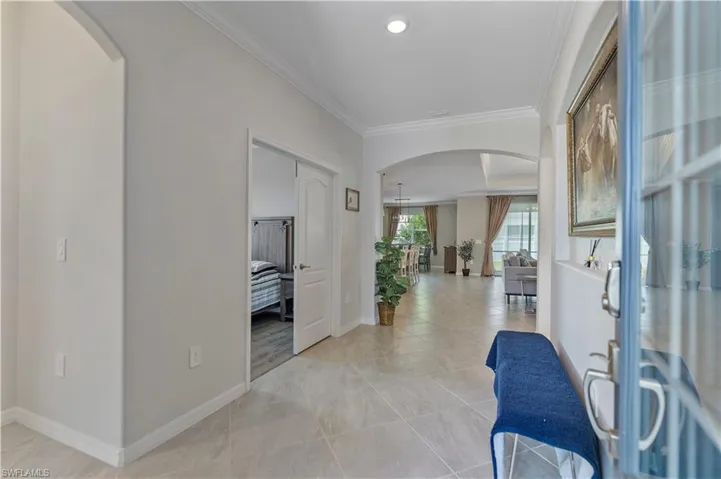 Foyer featuring crown molding