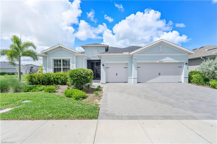 View of front of property with a garage