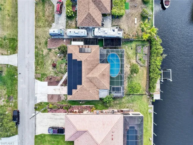 Solar Pool home on canal with dock and lift