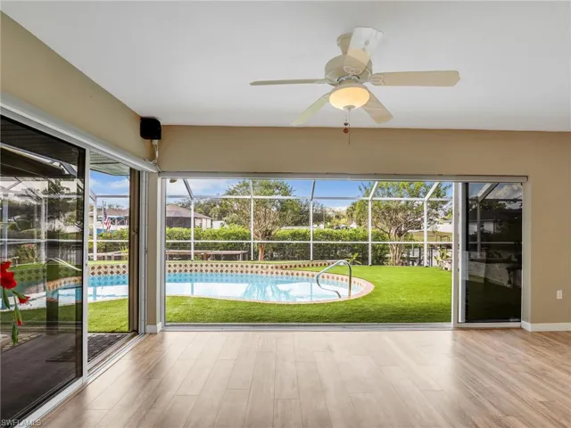 View of swimming pool with ceiling fan