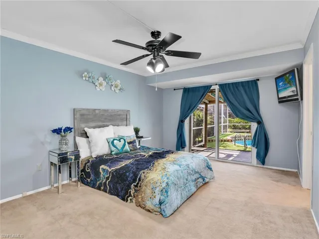 Bedroom featuring carpet flooring, crown molding, access to outside, baseboards, and a ceiling fan