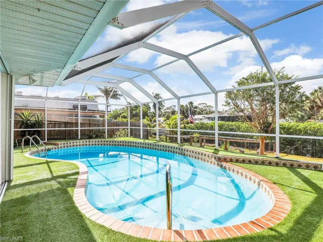 View of pool with screen enclosure