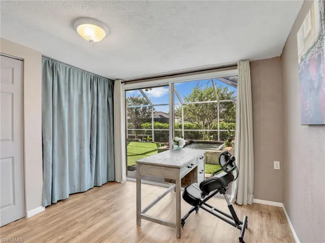 Office featuring a view overlooking Koi fish pond, pool and waterway