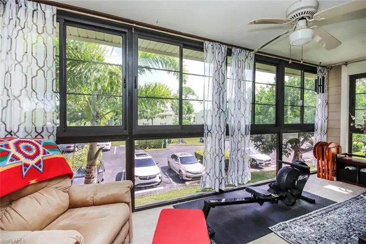 Sunroom / solarium with ceiling fan and plenty of natural light