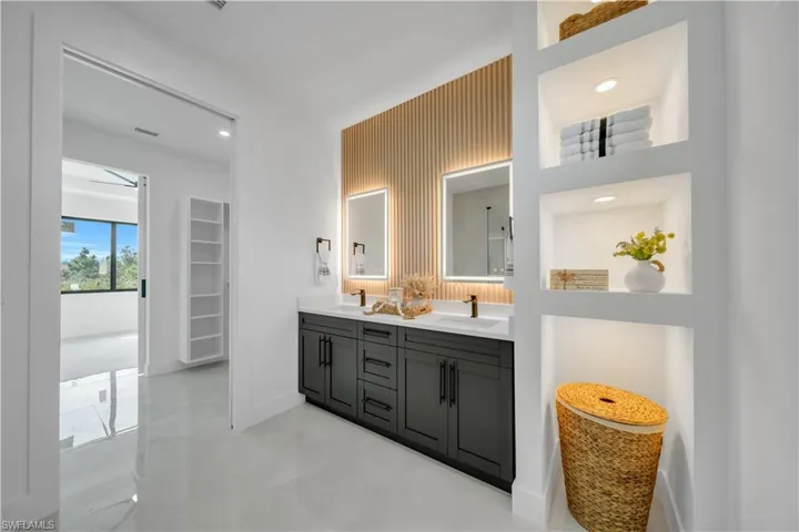 Bathroom with double vanity and recessed lighting