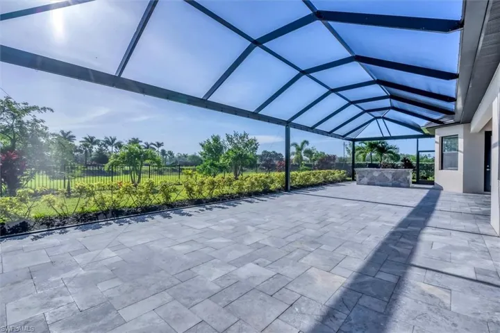 View of patio with a lanai and a carport