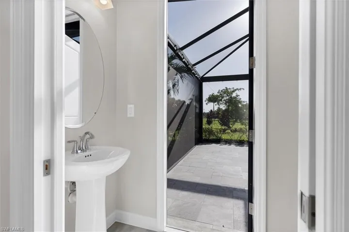 Bathroom with baseboards and a sink