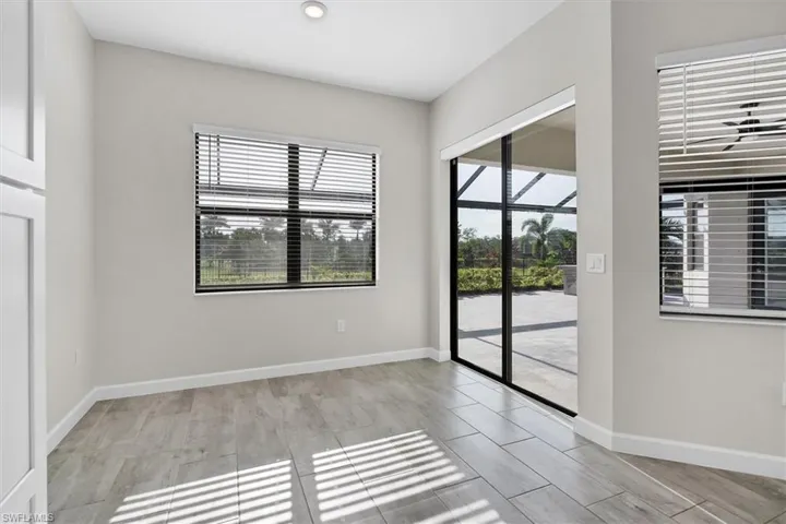 Spare room featuring recessed lighting and baseboards