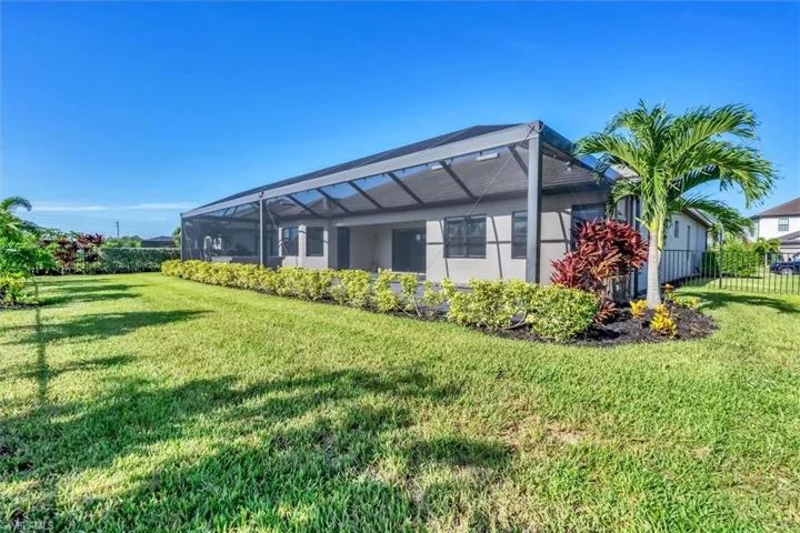 Back of house featuring a lanai